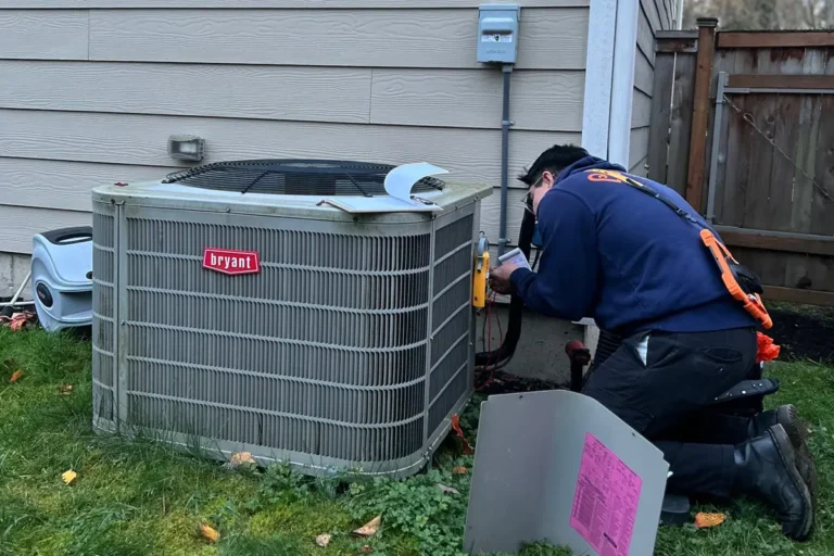 Harts HVAC Technician performing ac maintenance on a bryant air conditioner.