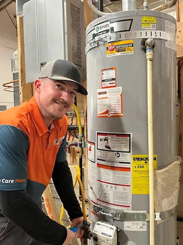 Harts plumber performing a water heater service in Silverdale, WA.