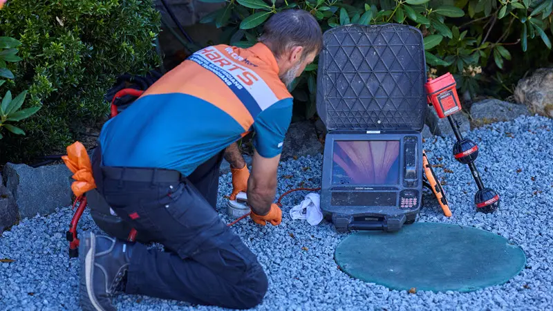 Harts technician conducting a sewer camera inspection at a Seattle property.