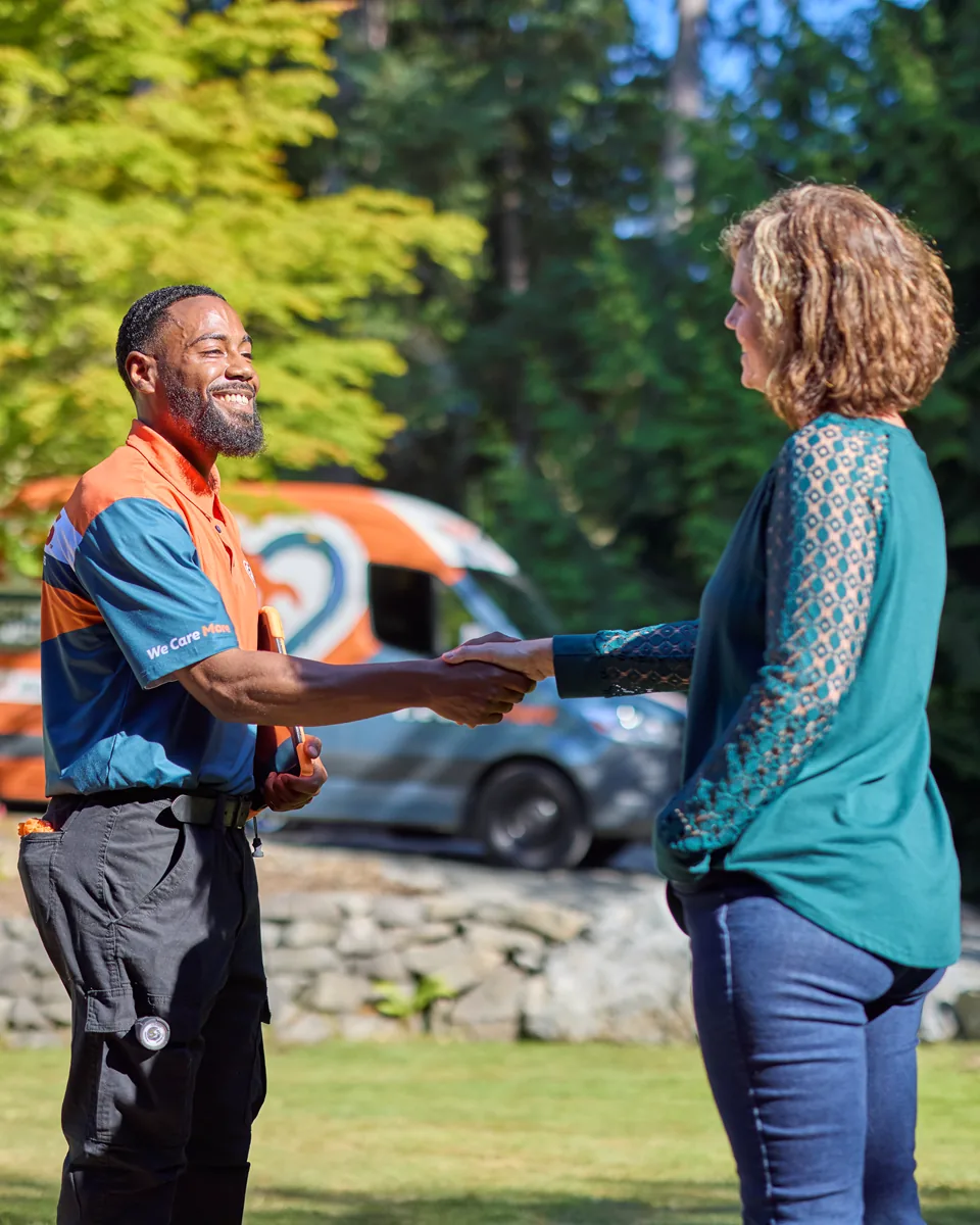 Harts technician greeting a homeowner before a service appointment
