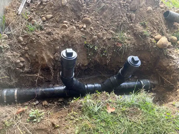 Exposed sewer line during repair excavation
